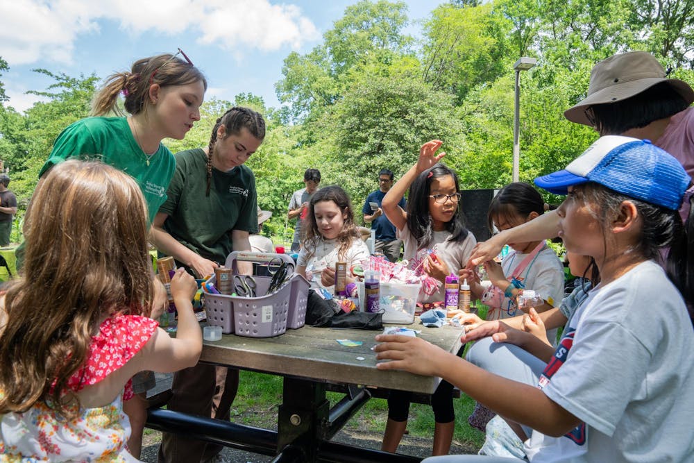 <p>Young kids build flowers out of recycled materials from the MSU Surplus store during the Music and the Garden event in East Lansing, Mich., on June 28, 2026.</p>