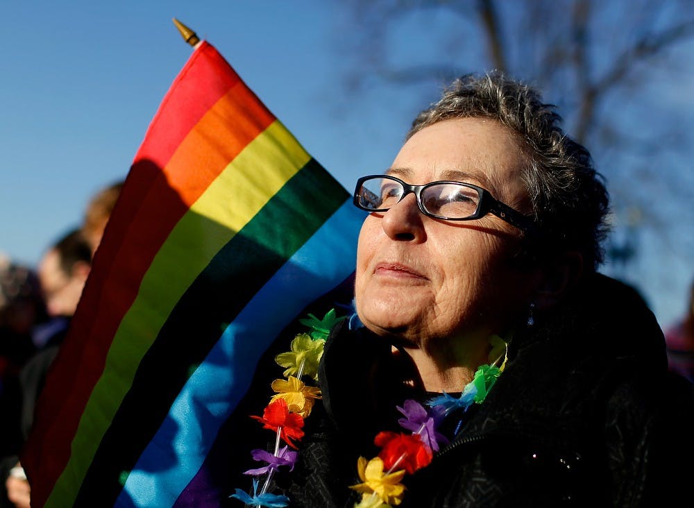 	<p>Gail Schulte, of Alexandria, Virginia, gathers with other demonstrators as arguments are heard on California&#8217;s Proposition 8 concerning gay marriage, outside the U.S. Supreme Court in Washington March 26, 2013. (Molly Riley/MCT)</p>