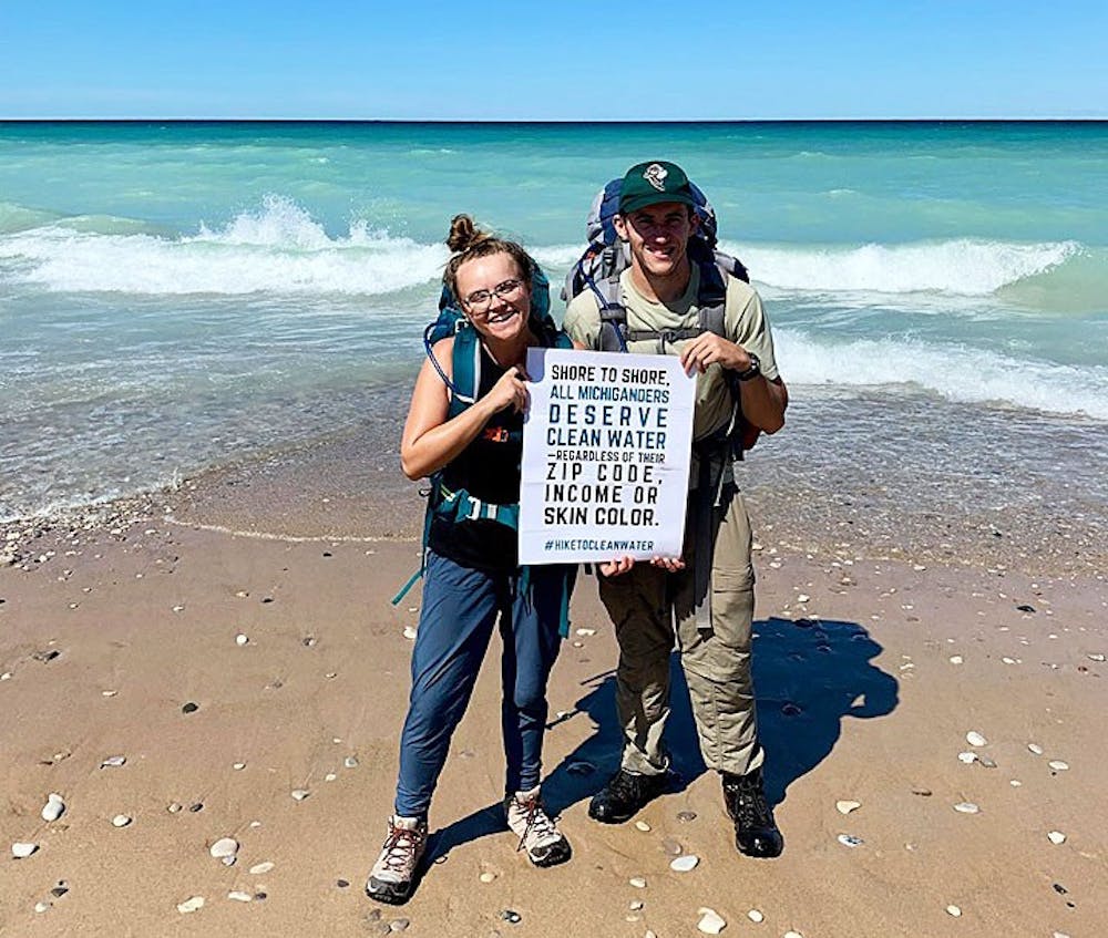 East Lansing residents Madeleine and Ross March-Meenagh completed a 220-mile trek of the Michigan Shore-to-Shore Trail on Aug. 3 to raise money and awareness for the Flint water crisis. (Photo courtesy of: Madeleine March-Meenagh.)