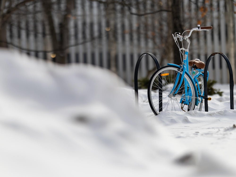 A blue bicycle in the snow outside the MSU Tech Store in East Lansing, Michigan, on Saturday, Feb. 7, 2026. 