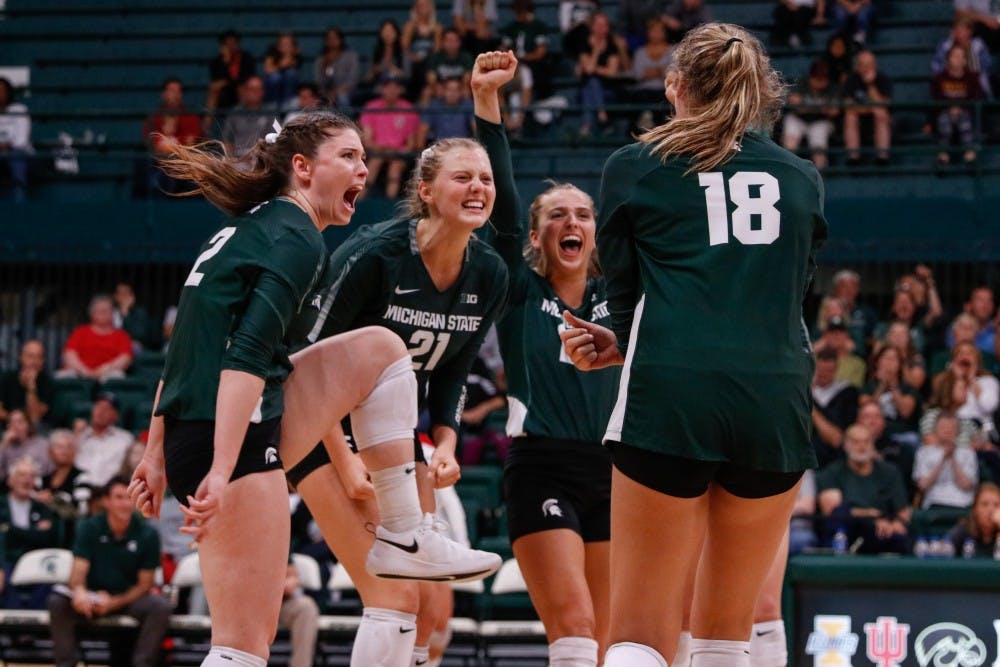 <p>The Spartans celebrate winning a match during the game against Cincinnati on Sept. 6, 2019, at Jenison Fieldhouse. The Spartans defeated the Bearcats, 3-1.</p>