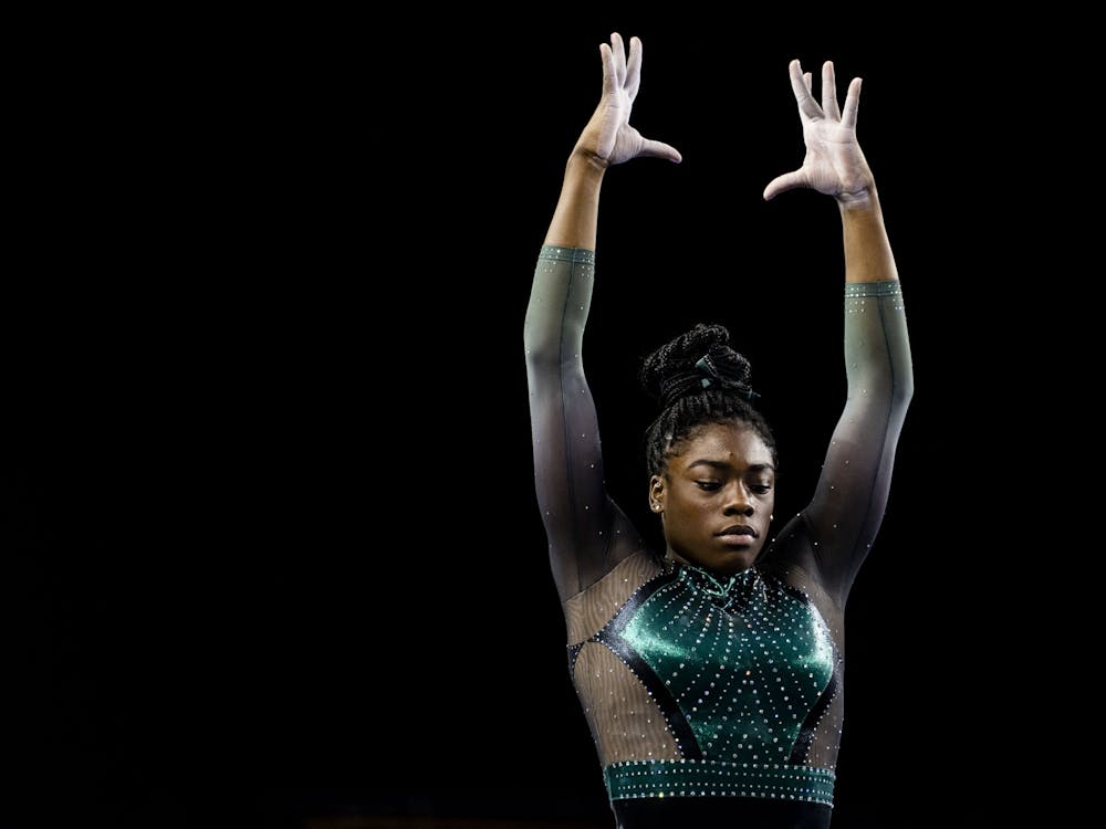 <p>All-around freshman Gabrielle Stephen on the balance beam at the meet against Michigan on January 30, 2022, at the Crisler Center in Ann Arbor. The Spartans lost to the Wolverines 197.925 to 196.775.</p>