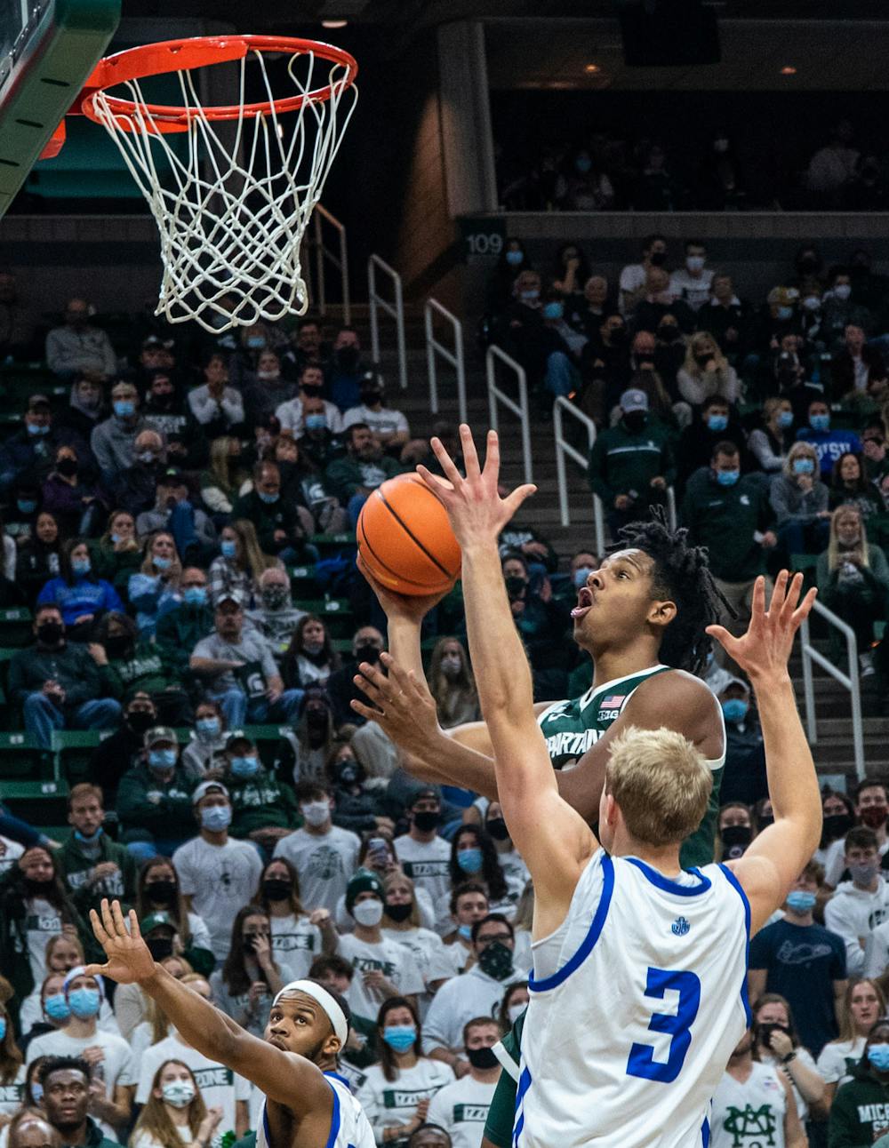 <p>Sophomore guard A.J. Hoggard (11) flies up to the net to score against Grand Valley in the second half. The Spartans beat the Lakers, 83-60, in a home exhibition game on Nov. 4, 2021.</p>