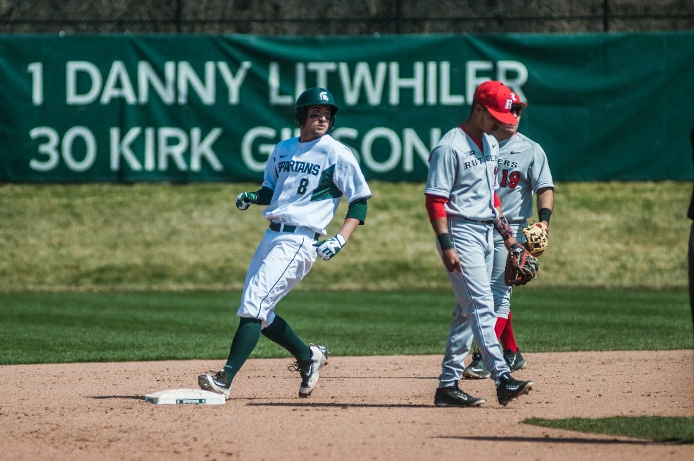 Senior infielder Justin Hovis walks through to second base during the first game on March 26, 2016 at McLane Stadium. The Spartans defeated the Scarlet Knights, 5-2.