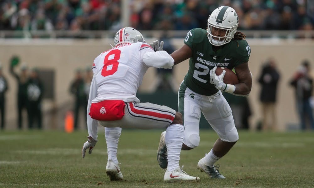 Junior wide receiver Darrell Stewart (25) runs with the ball during the game against Ohio State at Spartan Stadium on Nov. 10, 2018. The Spartans trail the Buckeyes, 7-3, at halftime.