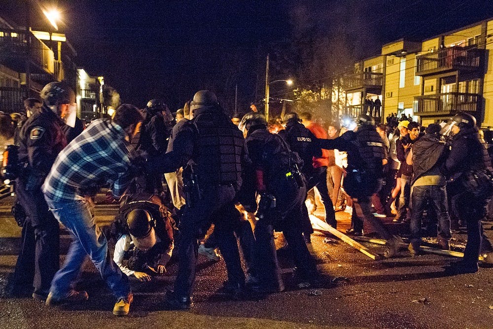 <p>MSU Police and East Lansing Police intervene on students' revelry March 28, 2015, on Waters Edge Drive by Cedar Village Apartments. The celebration were in reaction to the men's basketball win against Oklahoma during the Eastern Regional Semi-final round of the NCAA Tournament, "Sweet 16" in Syracuse, New York. The team will move on to be a part of the Elite Eight. </p>