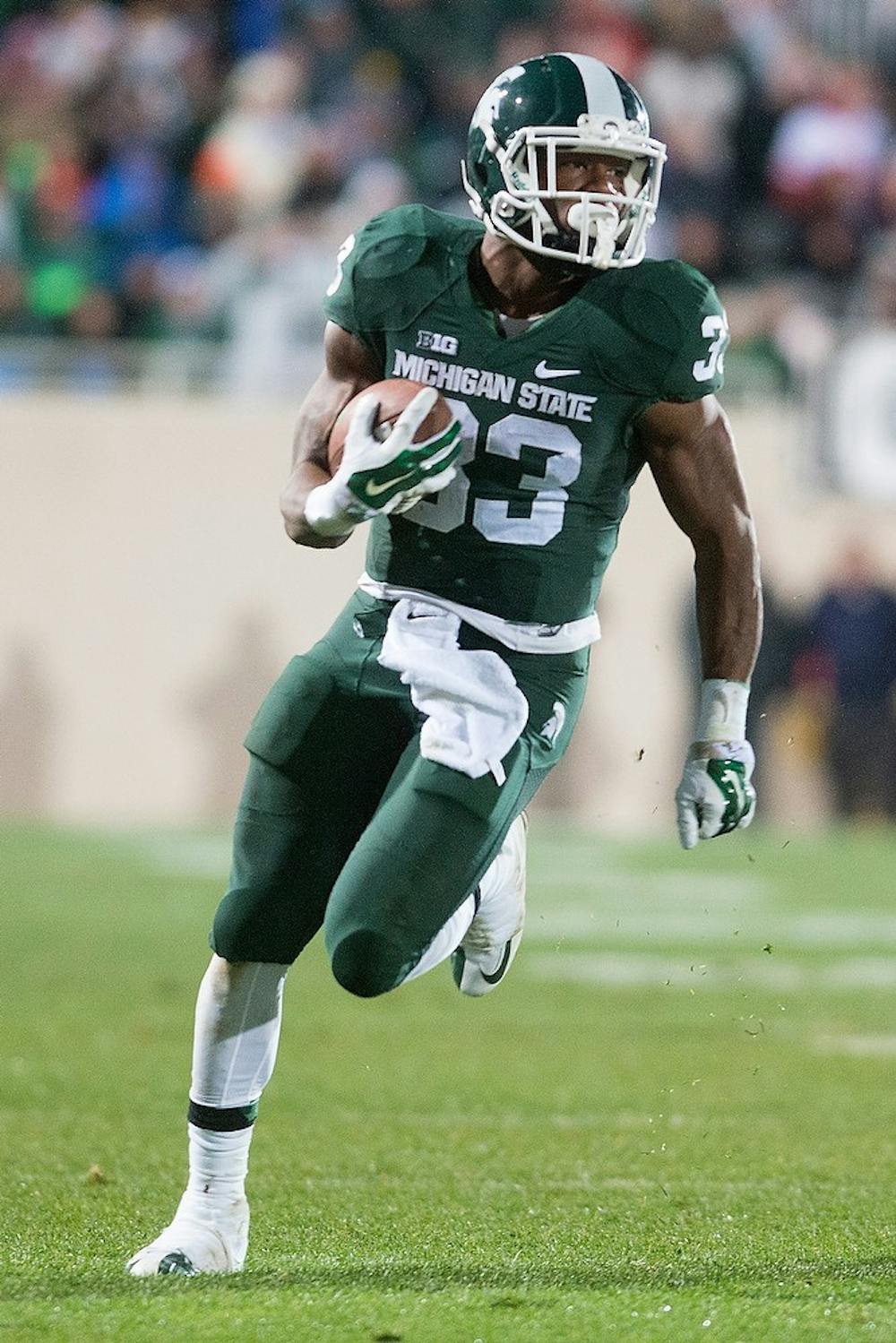 <p>Senior running back Jeremy Langford runs down the field during the game against Nebraska on Oct. 4, 2014, at Spartan Stadium. The Spartans defeated the Huskers, 27-22. Julia Nagy/The State News</p>