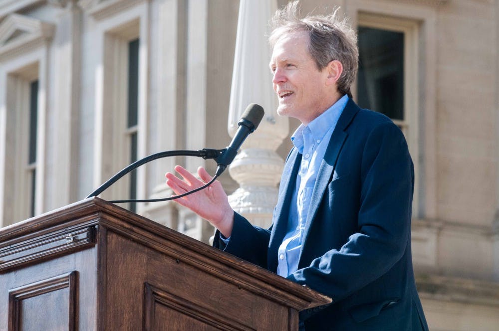 Michigan State Univeristy criminal justice professor Chris Smith speaks at the Students Demand Action Rally on March 14, 2018 at the Michigan State Capitol. (Annie Barker | State News)