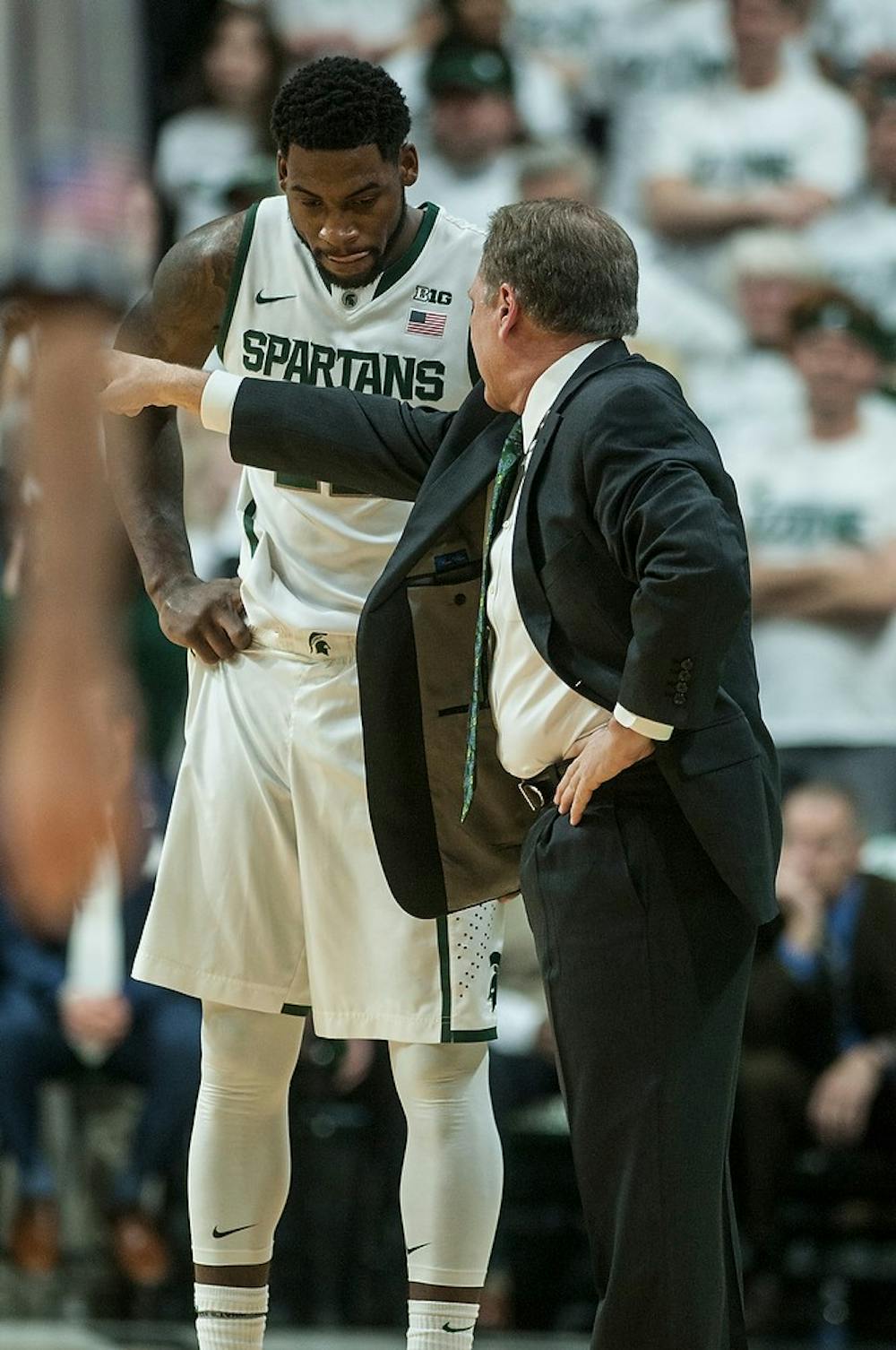 <p>Head coach Tom Izzo coaches senior forward/guard Branden Dawson on the sidelines Jan. 5, 2014, during the game against Indiana at Breslin Center. The Spartans defeated the Hoosiers, 70-50. Erin Hampton/The State News</p>