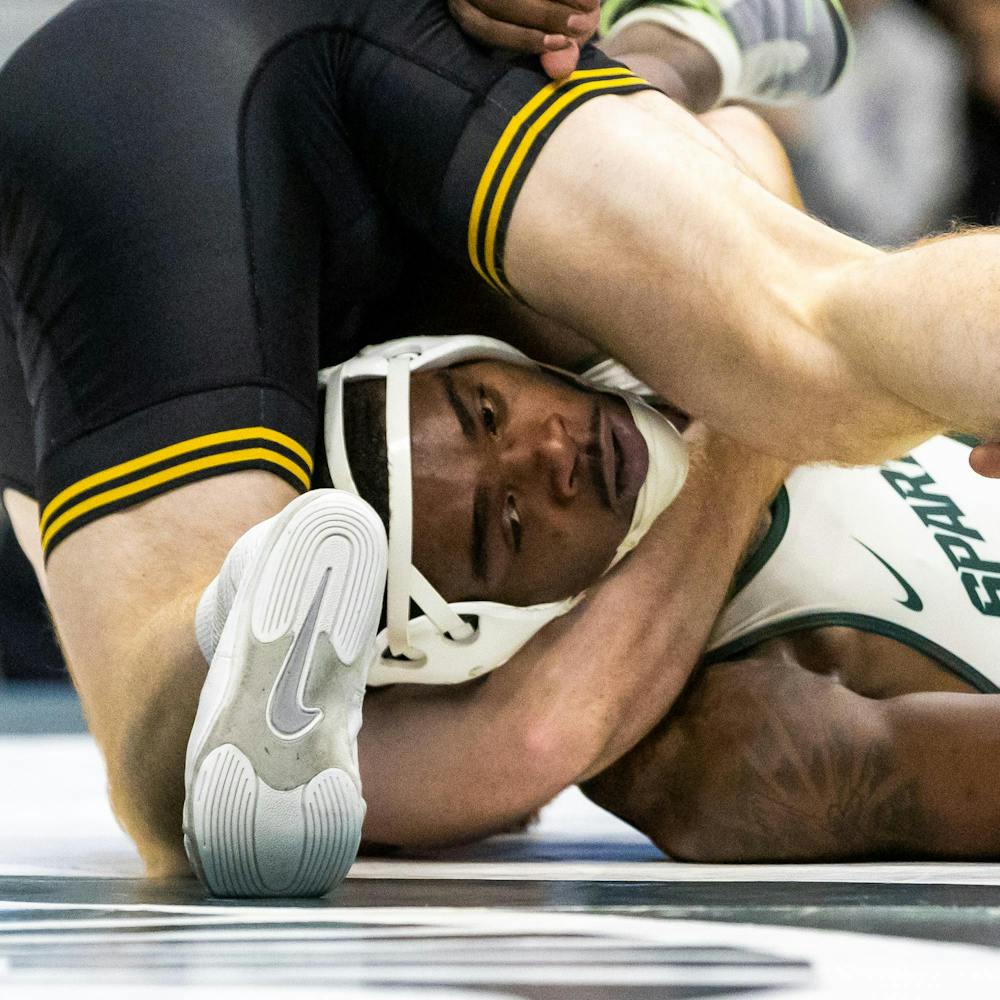MSU Gr. Wt. 165, DJ Shannon, is pinned under his Iowa opponent in the Jenison Field House in East Lansing, MI on Feb. 8 2026.