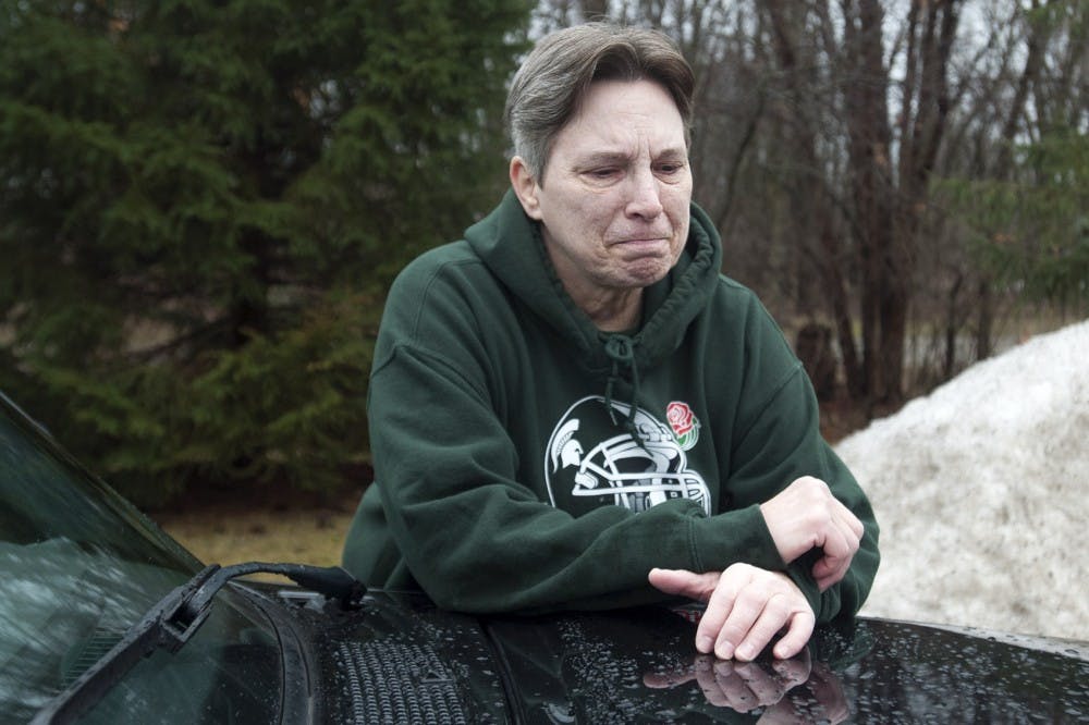 Lansing resident Liz Owczarzak cries on Jan. 24, 2017 at her apartment complex in Lansing. Owczarzak was formerly homeless, and began to cry when recollecting the hardships of her life; her truck was her home for about two months until she was able to be put in a shelter. Owczarzak mentioned that being scared during the nights was the hardest part of living in her vehicle.  "When you live in poverty, you don't have a lot of choices,"Owczarzak said. 
