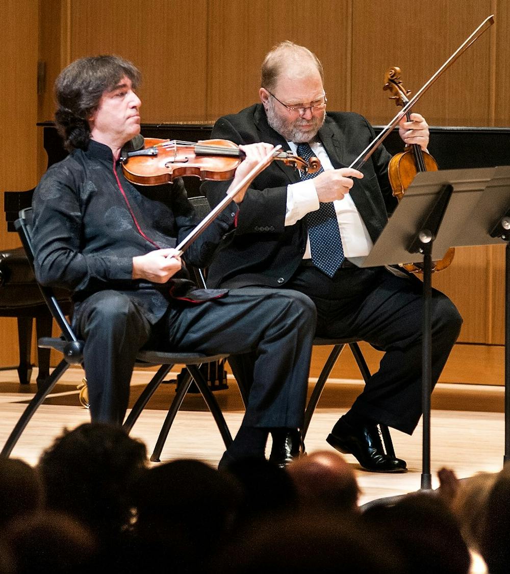 	<p>From left, associate professor of violin Dmitri Berlinsky, and professor of viola Yuri Gandelsman perform at Cook recital hall at the Music Building on Monday, Jan. 28, 2013. Jan. 27 was the 257th birthday anniversary of Mozart, and the concert was part of the Joanne and Bill Church West Circle Series. Justin Wan/The State News</p>