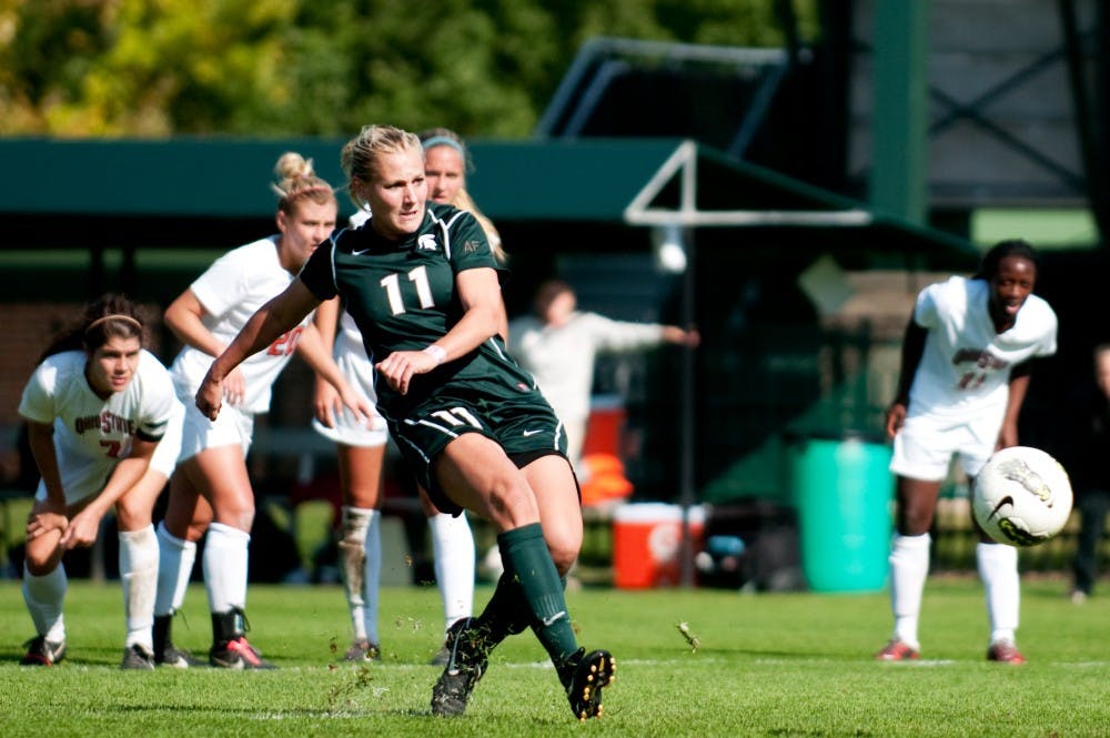 <p>Senior forward Laura Heyboer takes penalty kick which ended up in the back up of the net, securing the 2-0 lead for MSU in the second half. The Spartans defeated Ohio State, 2-0, in their final home game on Sunday afternoon at DeMartin Stadium at Old College Field. </p>