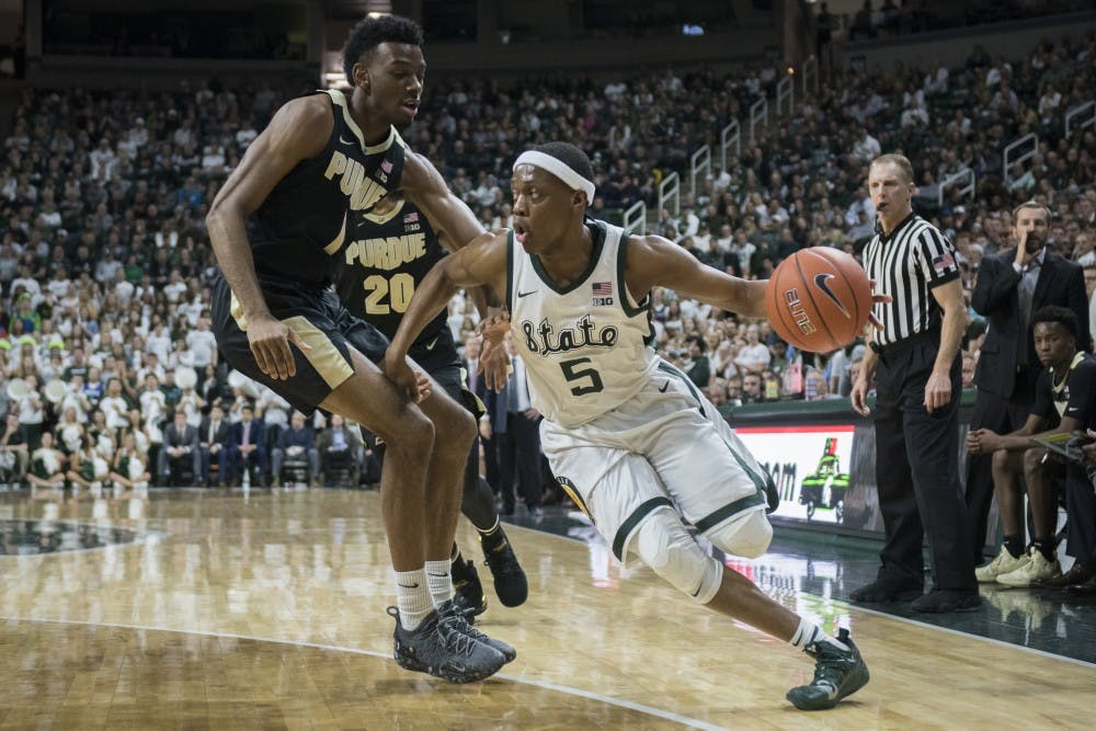 Junior guard Cassius Winston (5) drives to the net during the first half of the men's basketball game against Purdue on Jan. 8, 2018 at Breslin Center. The Spartans led the first half, 39-26.