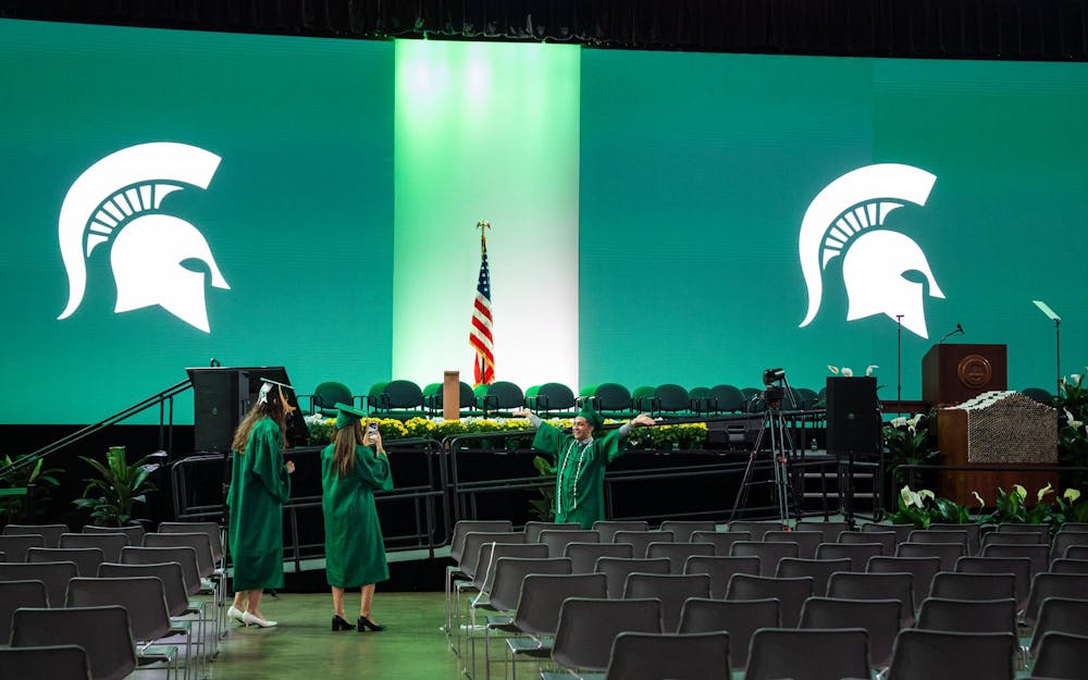 <p>Michigan State students take pictures in the Breslin Center in front of the graduation stage after attending their convocation in East Lansing, MI, on May 1, 2026.</p>