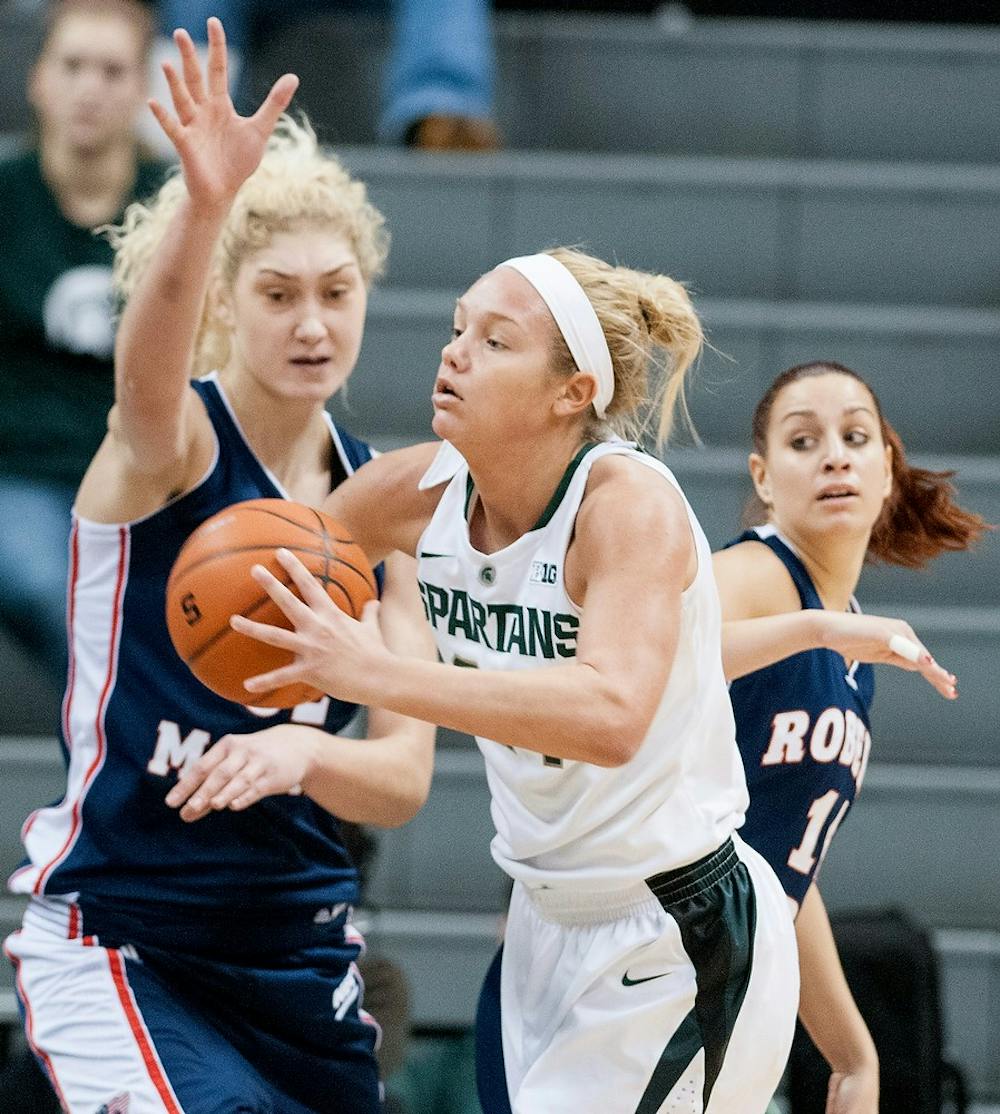 	<p>Senior forward Courtney Schiffauer pushes aside Robert Morris forward Anna Gailite while trying to pass the ball on Sunday, Nov. 25, 2012, at Breslin Center. The Spartans defeated the Colonials 68-35. Julia Nagy/The State News</p>