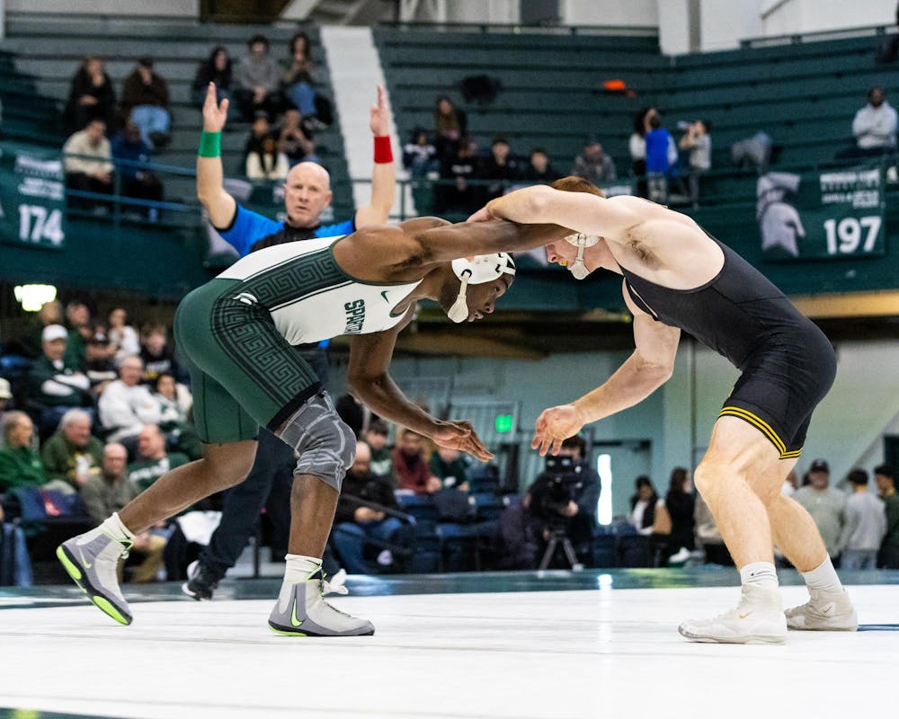 MSU Gr. Wt. 165, DJ Shannon, is readying himself against his Iowa opponent in the Jenison Field House in East Lansing, MI on Feb. 8 2026.