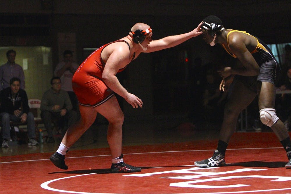 From left to right, Hinsdale Centrals' Matt Allen and Hinsdale Souths' Josh King wrestle during a meet on Jan. 26, 2016 at Hinsdale Central in Hinsdale, ILL. Allen won the match by one point during senior night at Hinsdale Central. Photo courtesy of Hinsdale Central Athletics.
