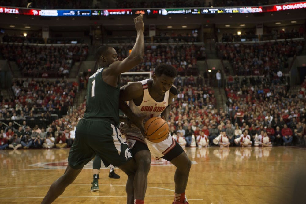 Sophomore guard Joshua Langford (1) guards an Ohio State player during the MSU vs. Ohio State game. The Spartans lost 80-64