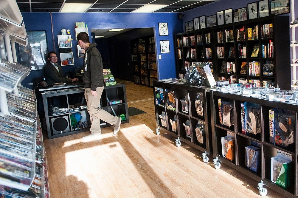 	<p>Theater senior and co-owner Gabriel Cooper, left, and co-owner Aaron Solon converse while waiting for customers Jan. 8, 2014, at Hollow Mountain Comics on Grand River Ave. The store opened New Years day. Erin Hampton/ The State News</p>