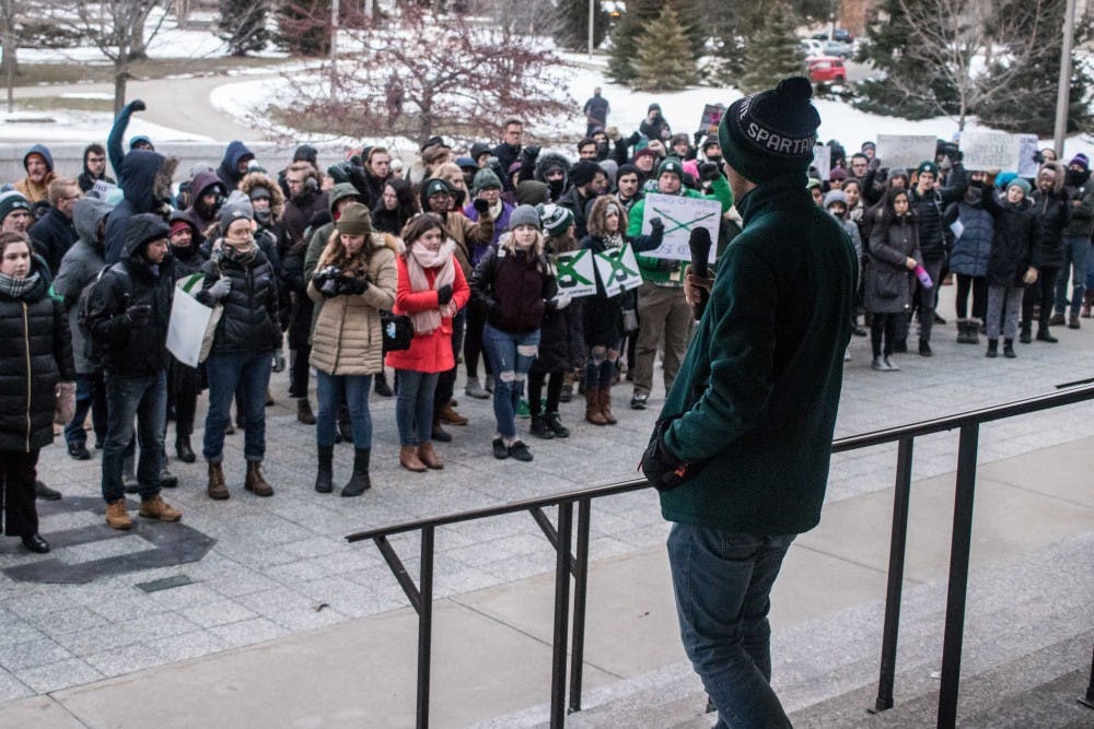 A speaker for the MSU College Democrats addresses the crowd at the March for Transparency, on Feb. 2, 2018, at the Hannah Administration Building.