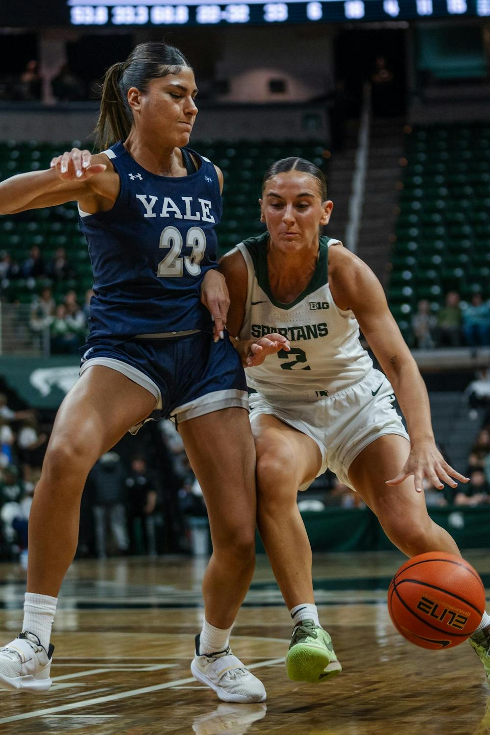 Michigan State junior guard Abbey Kimball (2) battles to keep the ball from Yale junior guard Lola Lesmond (23) at the Breslin Center on Nov. 8, 2024. The Spartans took a 100-44 victory over the Bulldogs.