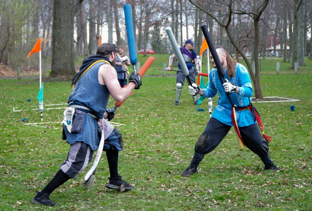 Current Champion of Ashen Hills Michael O'Meara (Master Dong) appears to engage in battle with Aaron Barber (TalcusPrye) at Ashen Hills LARP in Patriache Park, on May 1, 2022.