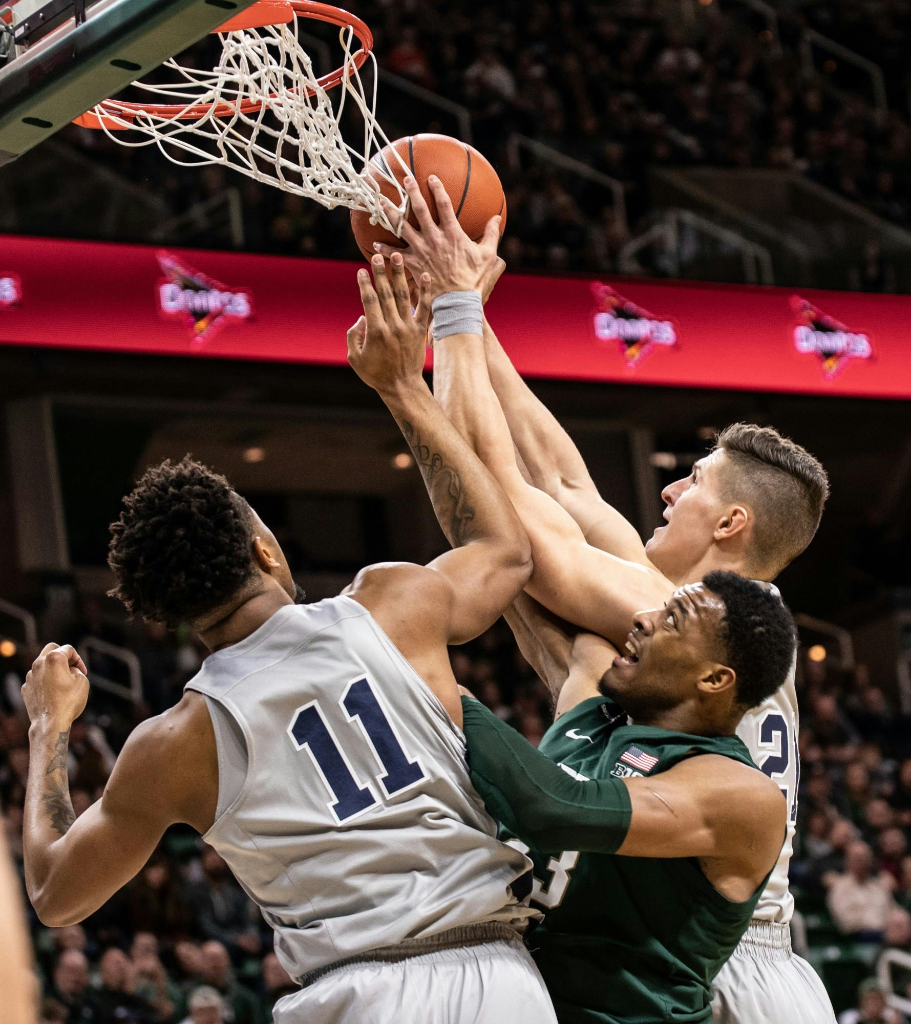 Forward Xavier Tillman fights for possession during a basketball game against Penn State at the Breslin Center on Feb. 4, 2020.