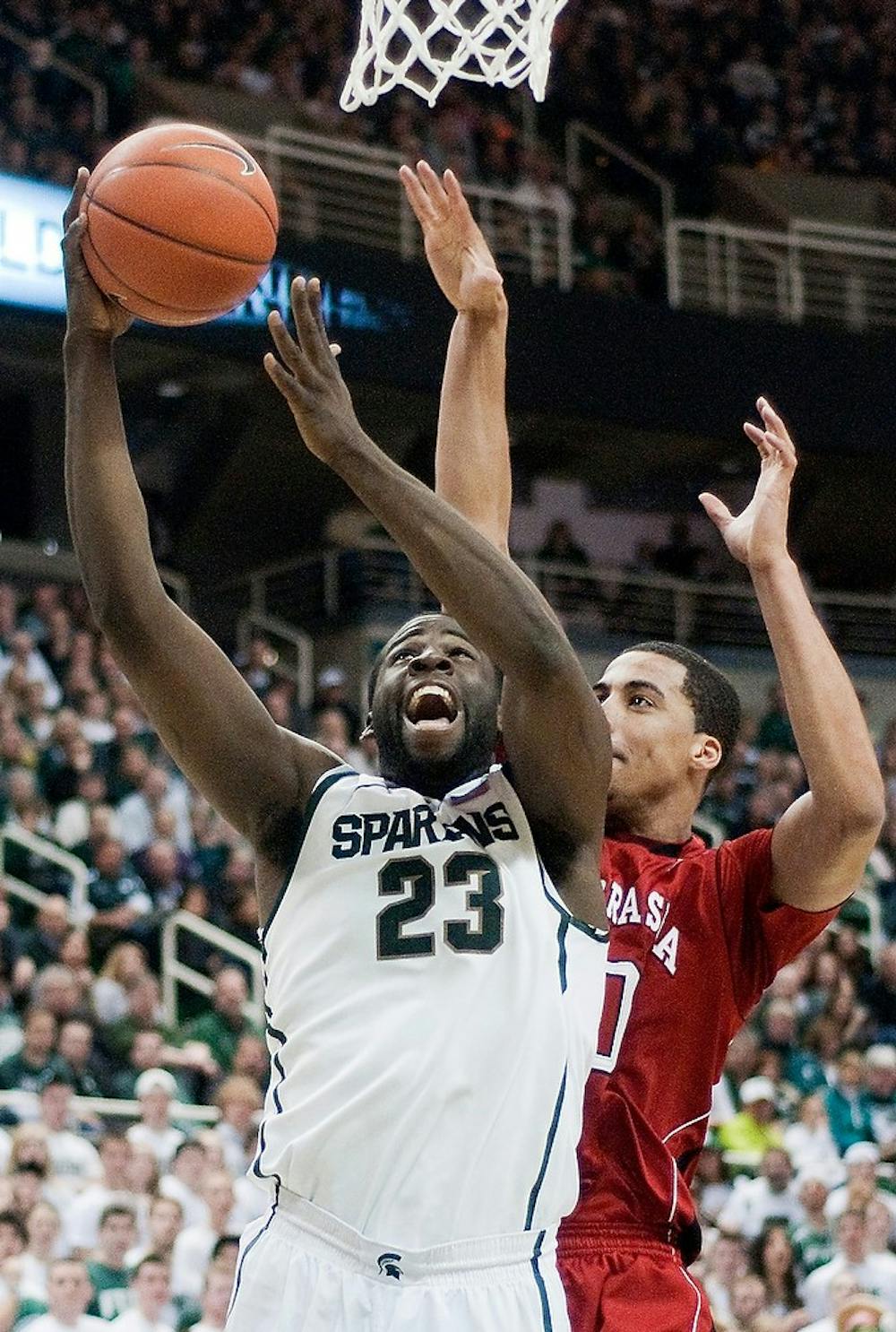 <p>Senior forward Draymond Green beats Nebraska guard Toney McCray to the basket for two points. The Spartans defeated the Cornhuskers 62-34 Saturday night at Breslin Center. Anthony Thibodeau/The State News</p>