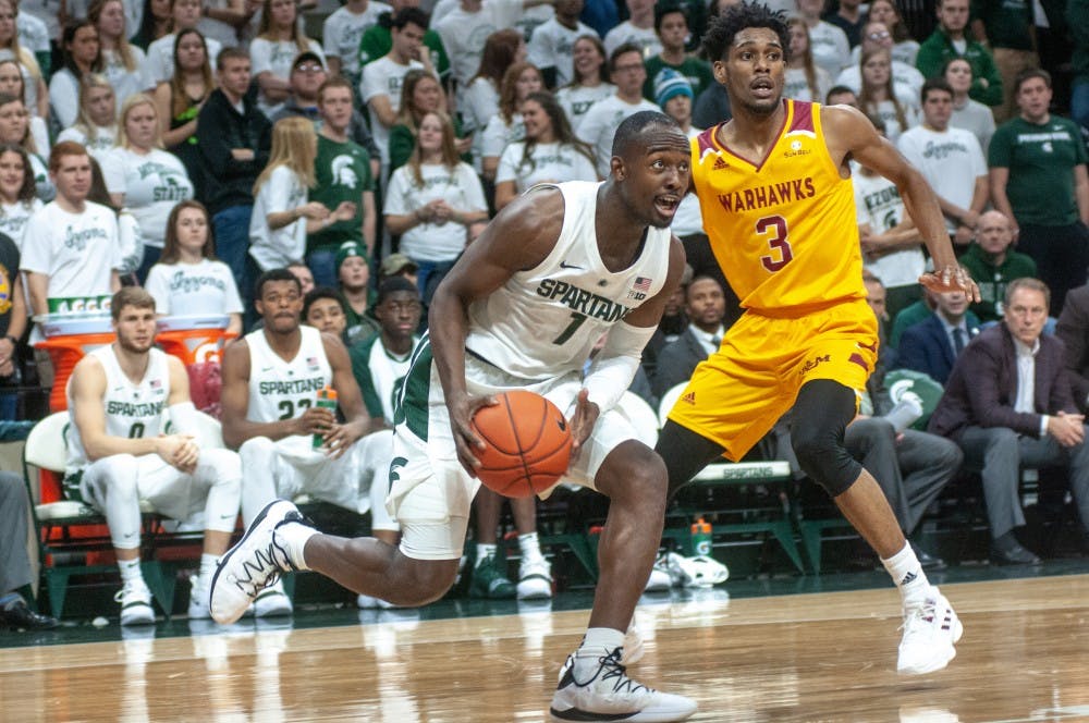 Junior guard Joshua Langford (1) moves with ball against University of Louisiana-Monroe’s guard Javien Williams (3) during the game against University of Louisiana-Monroe at Breslin Center on Nov. 14, 2018. The Spartans defeated the Warhawks, 80-59.