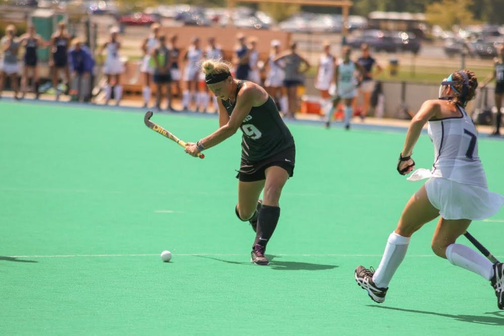 <p>Redshirt-junior midfielder Kendal Anderson shoots the ball in a field hockey game for MSU. &nbsp;Photo courtesy of MSU Athletic Communications.</p>