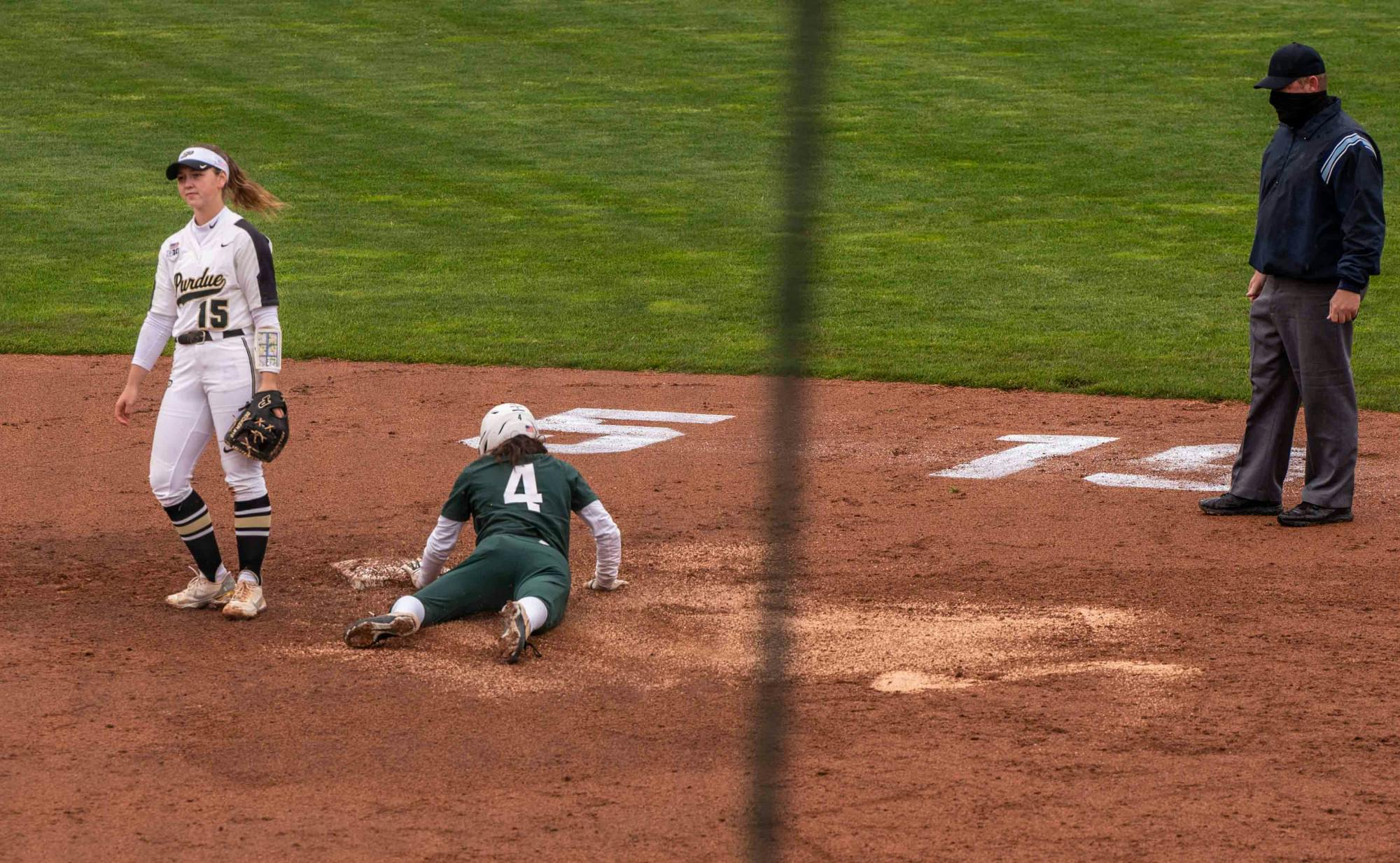 <p>Senior outfielder Katie Quinlan (4) steals a base in the fourth inning without Purdue&#x27;s infielder Rachel Becker noticing. The Boilermakers made a seven-run comeback in the sixth inning to top the Spartans 9-6 at Secchia Stadium on April 24, 2021.</p>