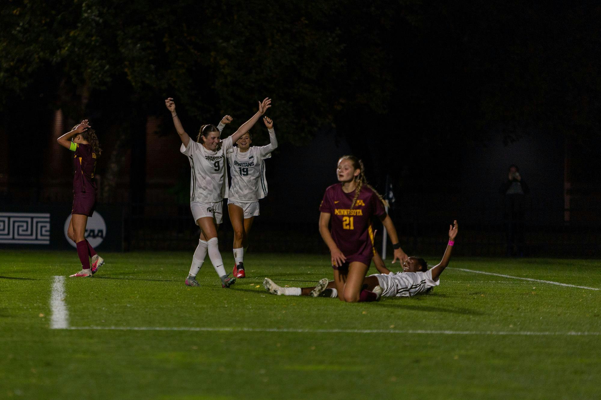 <p>Michigan State senior midfielders Kayla Briggs (9) and Emerson Sargeant (19) and senior forward Kennedy Bell (24) celebrate a goal during the soccer game against Minnesota at DeMartin Stadium in East Lansing, Michigan, on Thursday, Oct. 8, 2026.</p>