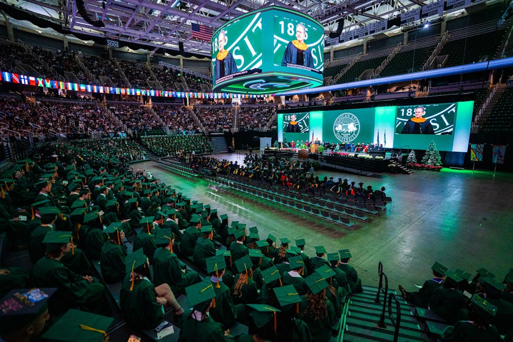 <p>Michigan State University alumni listen to an address during the fall 2024 commencement ceremony at the Breslin Center on Dec. 14, 2024.</p>