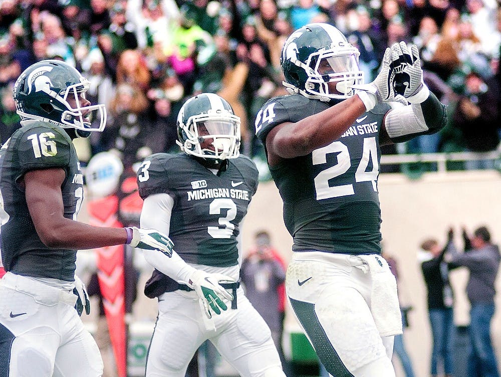 	<p>Junior running back Le&#8217;Veon Bell celebrates by showing the Spartan logo with his gloves after scoring a touchdown Nov. 3, 2012, at Spartan Stadium. Bell rushed for 188 yards and scored two touchdowns during the 28-24 loss to Nebraska. State News File Photo</p>