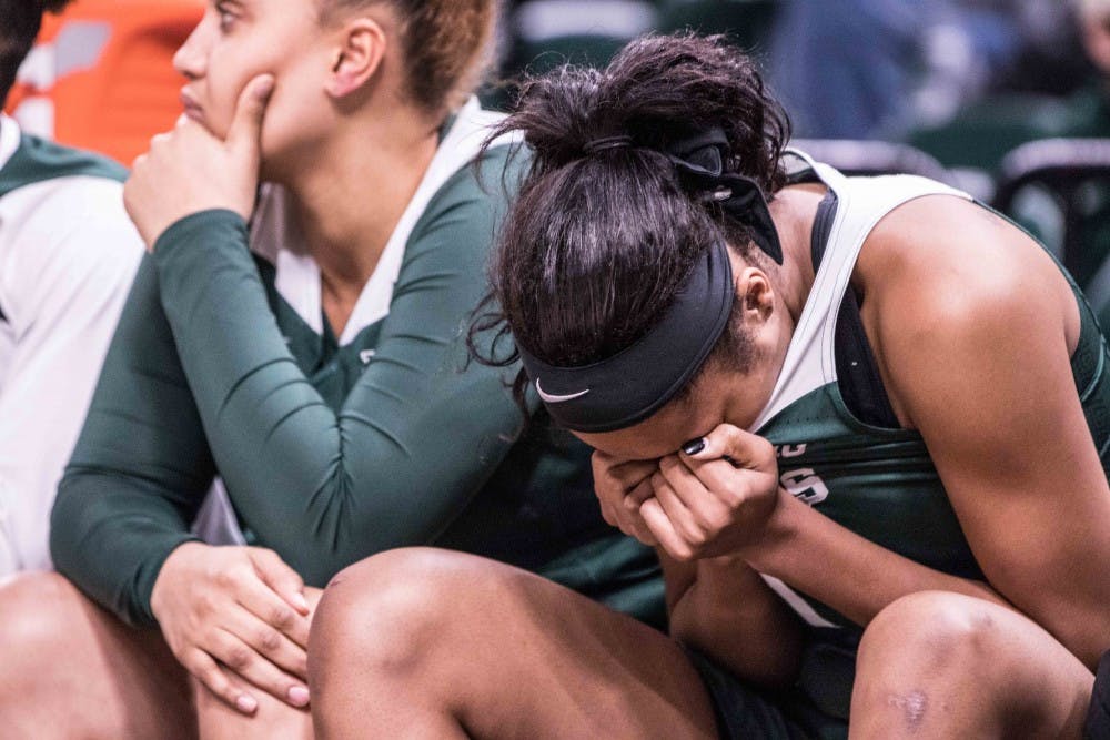 <p>Freshman forward Sidney Cooks (1) puts her face in her shirt towards the end of the fourth overtime during the game against Indiana on March 1, 2018 at Bankers Life Fieldhouse. The Spartans fell to the Hoosiers, 111-109, in 4OT.</p>