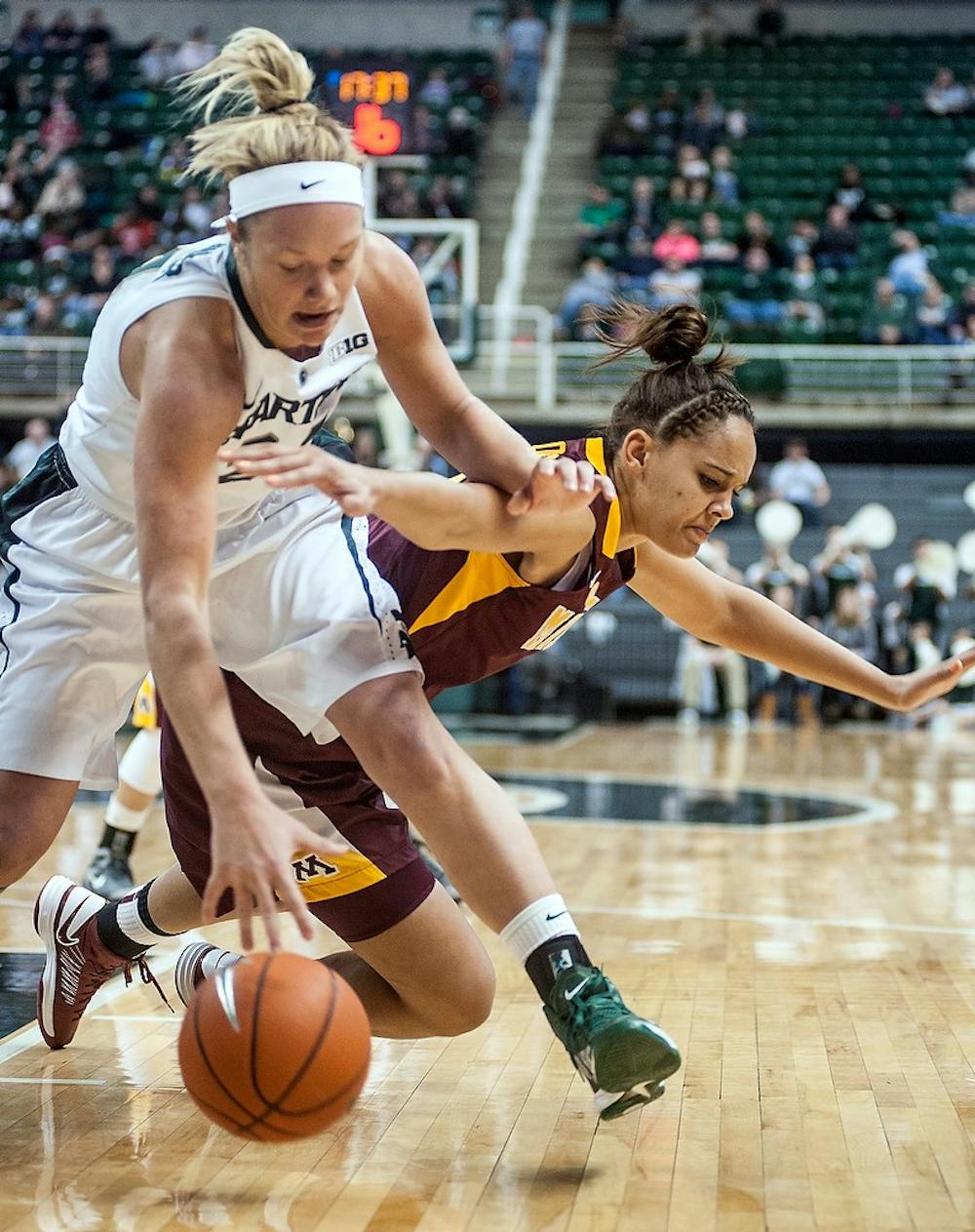 	<p>Senior forward Courtney Schiffauer fights for a loose ball with Minnesota guard/forward Kionna Kellogg. The Spartans defeated the Gophers, 66-51, Thursday, Jan. 3, 2012, at Breslin Center. Justin Wan/The State News</p>