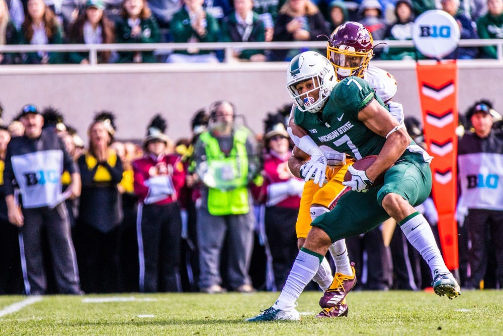 <p>Sophomore wide receiver Cody White (7) attempts to shake a tackle during the game against Central Michigan on Sept. 29, 2018 at Spartan Stadium. The Spartans defeated the Chippewas, 31-20.</p>