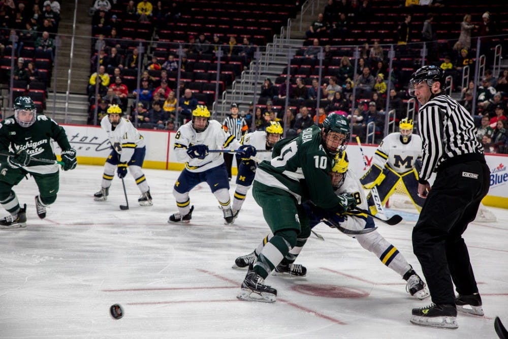 Junior center Sam Saliba (10) watches the puck during the game against Michigan on Dec. 31, 2018 at Little Caesar's Arena in Detroit. The Spartans were ahead 2-1 at the end of the 1st period.