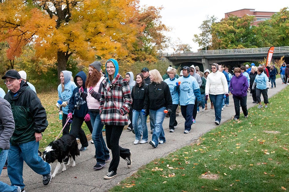 	<p>Participants in the Take Steps walk for Crohn&#8217;s and Colitis begin their walk on Saturday, Oct. 6, 2012 at the rock on Farm lane. Take Steps is a national organization with the goal of raising awareness and funding for Crohn&#8217;s and Colitis. James Ristau/The State News</p>