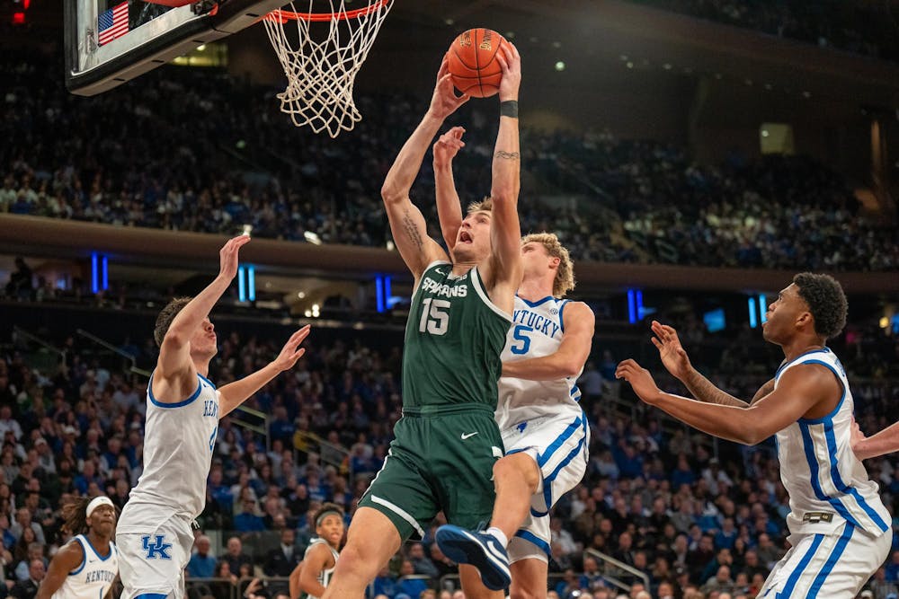<p>Michigan State center Carson Cooper (5) attempts a shot during a game against Kentucky in the State Farm Champions Classic at Madison Square Garden in New York on Tuesday, Nov. 18, 2025.</p>