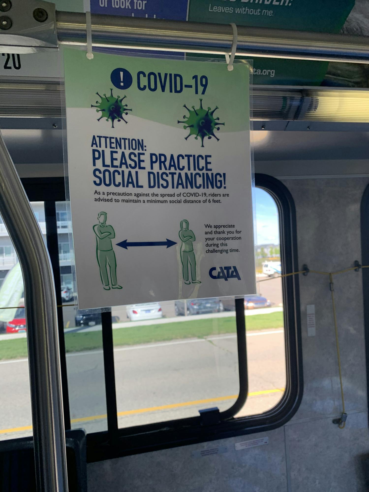 <p>A COVID-19 social distancing sign is pictured inside an empty CATA bus on August 31, 2020.</p>