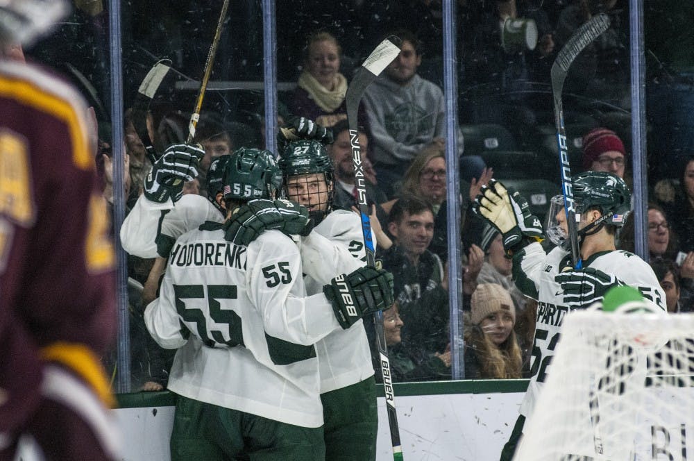The Spartans celebrate after scoring a goal during the second period in the game against Minnesota on Dec. 9, 2016 at Munn Ice Arena. The Spartans were defeated by the Gophers, 4-2.