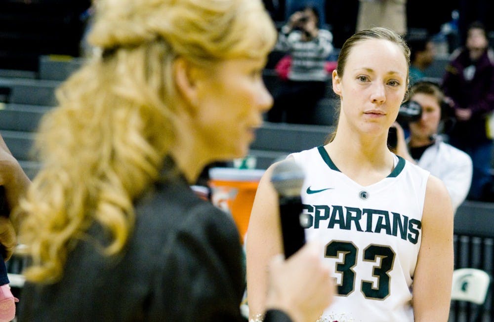 Senior guard Taylor Alton listens as head coach Suzy Merchant talks about her voyage over the years as a Michigan State spartan Thursday night at Breslin Center. The spartans went on to defeated Nebraska 73-53. Aaron Snyder/The State News
