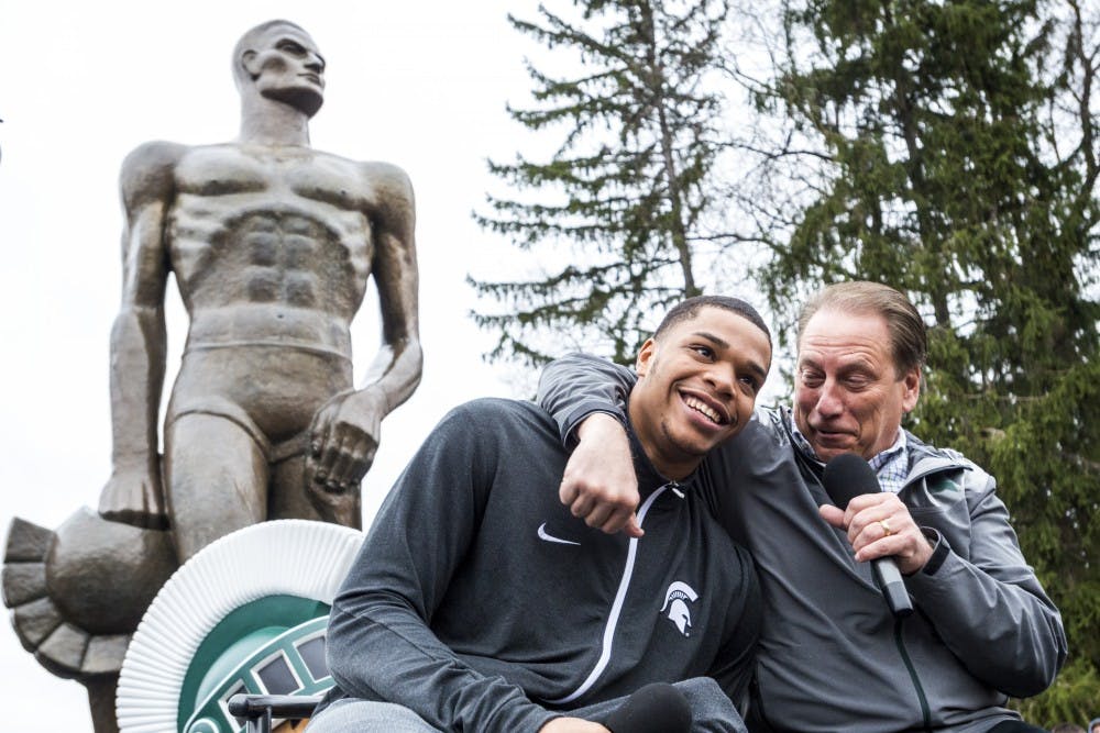 Head coach Tom Izzo embraces freshman forward Miles Bridges (22) during the Bridges's announcement that he will be continue his MSU basketball career on April 13, 2017 at The Spartan statue. Hundreds of students gathered around the statue in support of Miles Bridges's return to MSU.