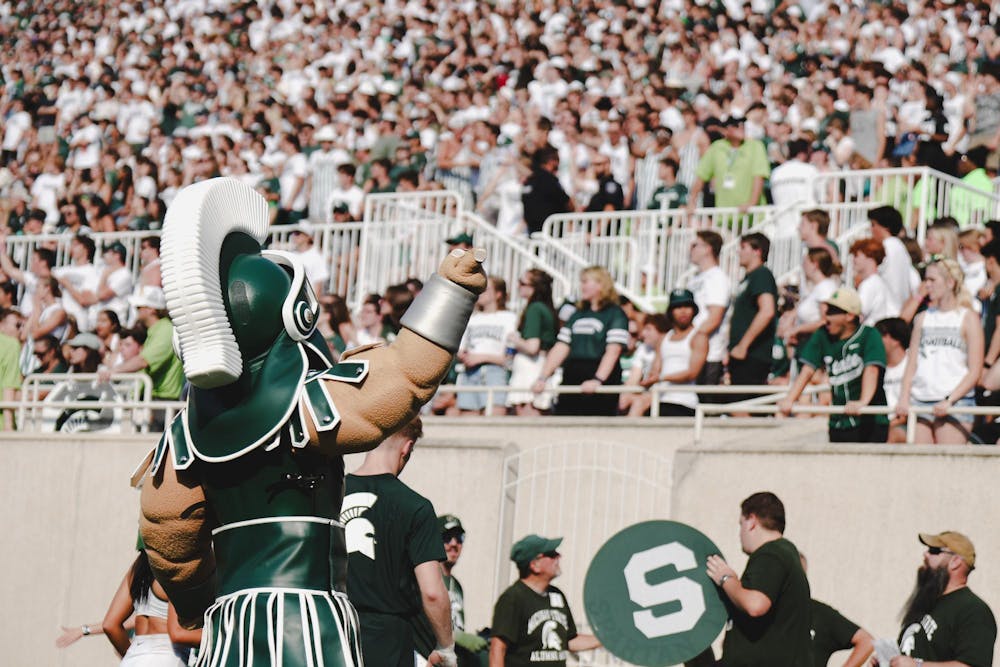 <p>Sparty points to his student section after a first down during the MSU versus Prairie View game at Spartan Stadium on Sept. 14, 2024.</p>