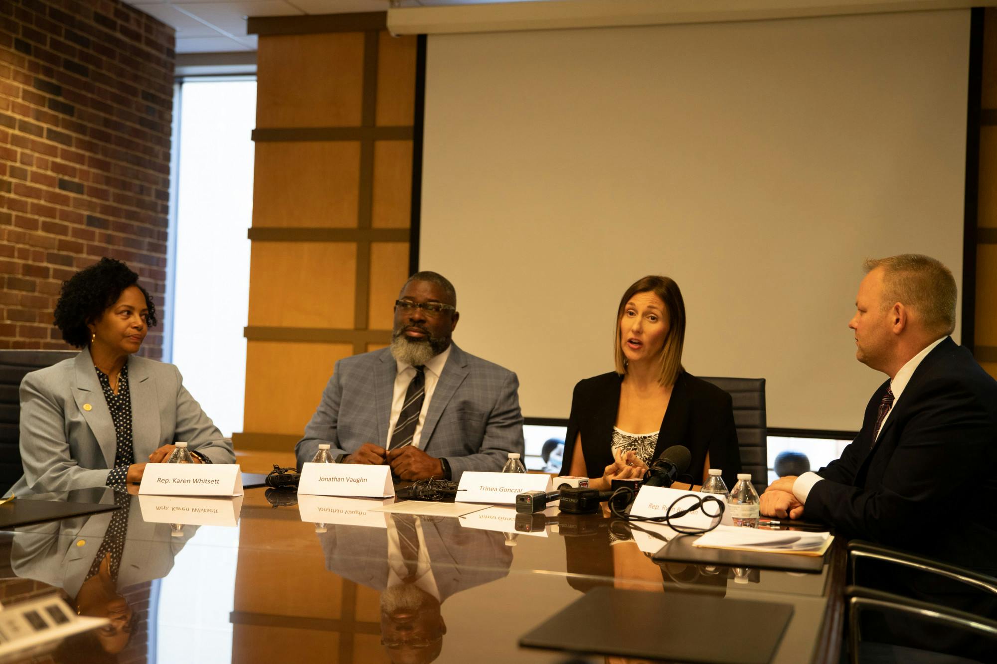 Starting left to right State Representative for Michigan Karen Whitsett, survivor Jonathan Vaughn, survivor Trinea Gonczar, and State Representative for Michigan Ryan Berman. Gonczar is seen speaking in this photo during the press conference for the committee of empowering survivors on Sept. 30, 2021. 