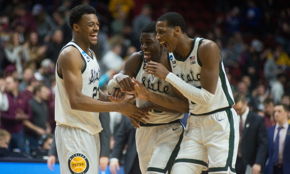 The Spartans celebrate after winning the second round game of the NCAA tournament against Minnesota at Wells Fargo Arena March 23, 2019. The Spartans defeated the Gophers, 70-50.