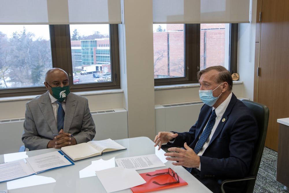 <p>President Stanley talks with ACE Fellow Wondwossen Gebreyes in his office on Dec. 1, 2021.</p>