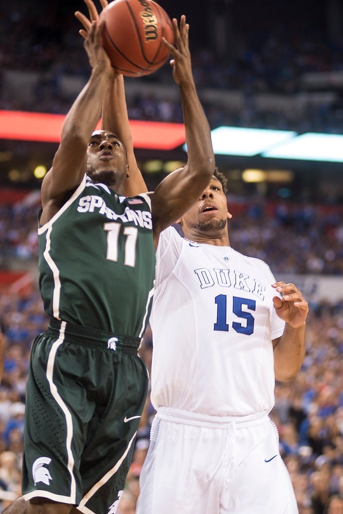 <p>Freshman guard Lourawls "Tum Tum" Nairn attempts a basket April 4, 2015, during the semi-final game of the NCAA Tournament in the Final Four round at Lucas Oil Stadium in Indianapolis, Indiana. The Spartans were defeated by the Blue Devils, 81-61. Erin Hampton/The State News</p>